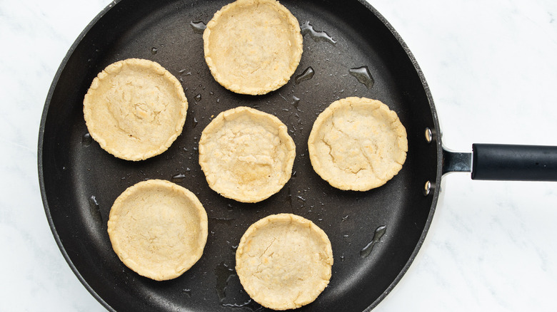 sopes frying in pan