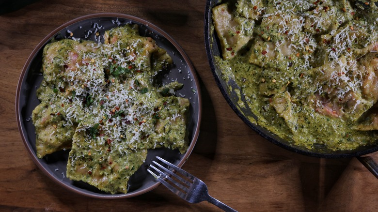 pan and plate of ravioli in green sauce