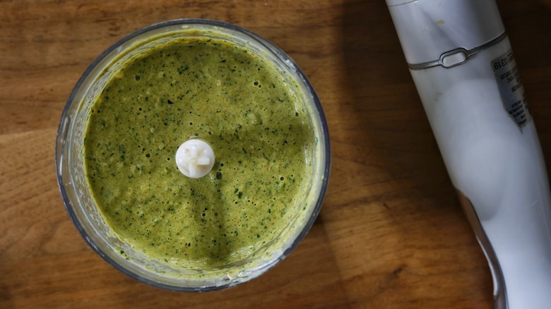 food processor with pureed green sauce