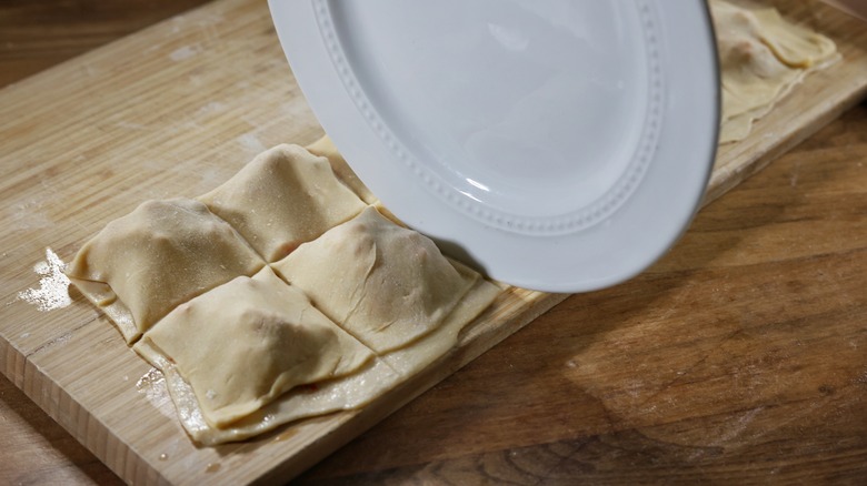 slicing ravioli with a plate edge