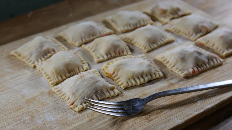 ravioli on cutting board with fork