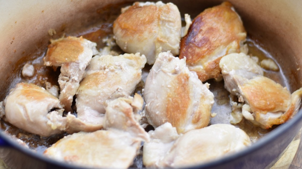 Cooked chicken thighs in pan