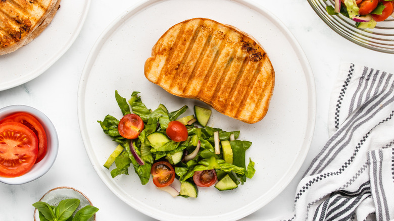 panini and salad on plate