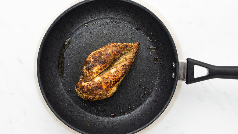 chicken breast searing in pan