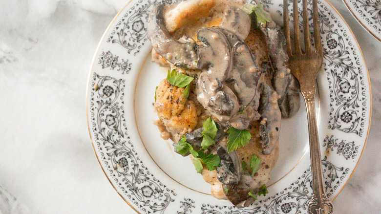 Mushroom-topped chicken on plate