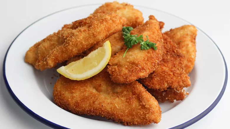 Breaded chicken tenders on a plate