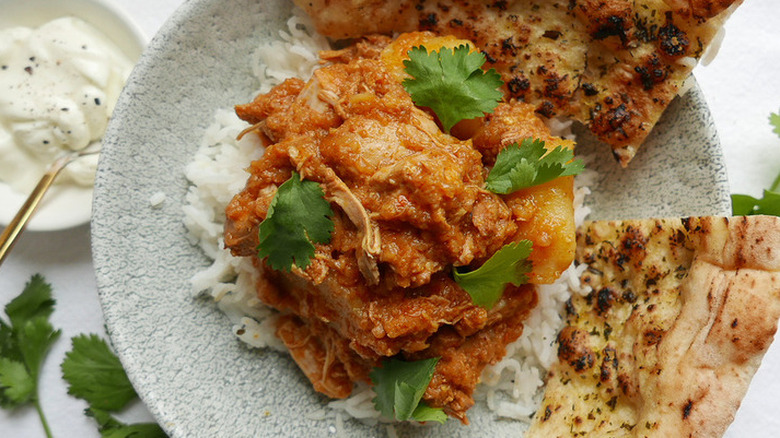 Curried chicken with rice and naan