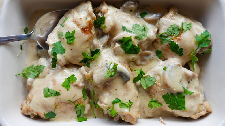 Creamy chicken pieces in baking dish