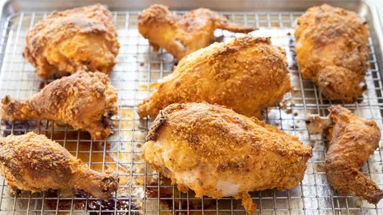 Pieces of fried chicken on a sheet pan