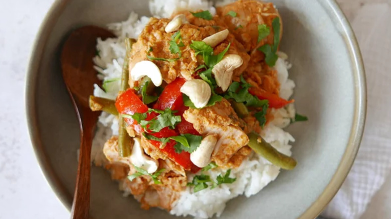 Bowl of rice topped with chicken stew