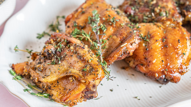 Seasoned cooked chicken thighs with herbs