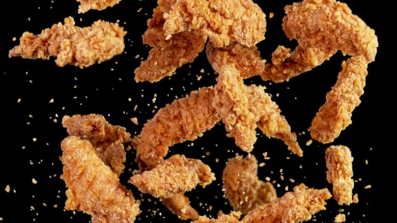 Fried chicken on black background