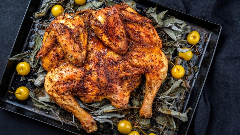 Crispy spatchcocked chicken on baking sheet