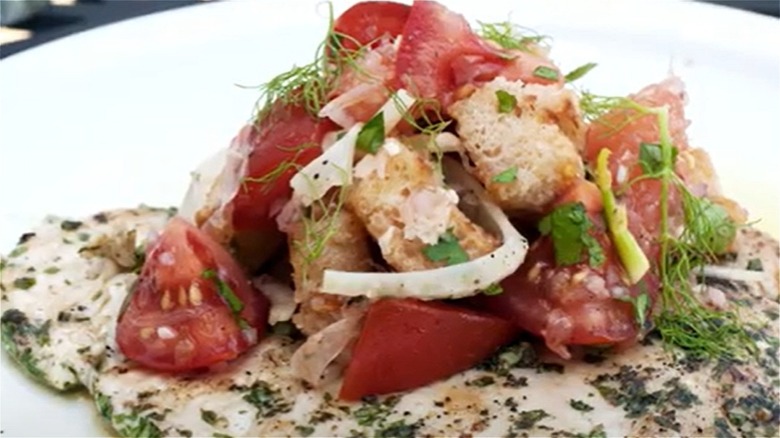 chicken paillard topped with panzanella 