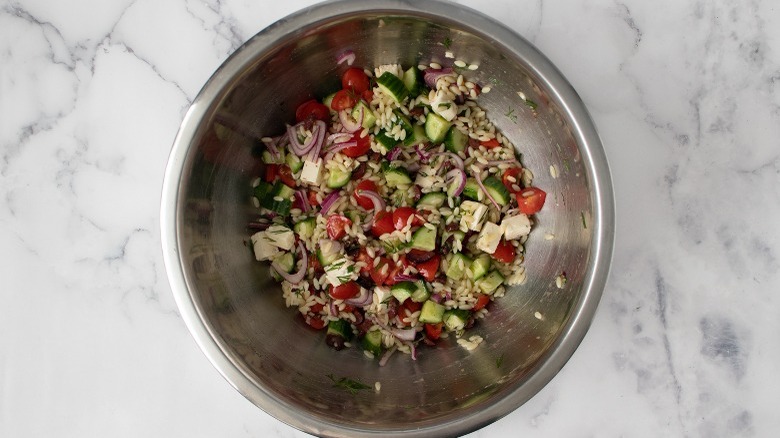 orzo salad tossed with dressing