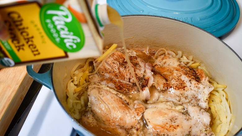 pouring chick stock into pot