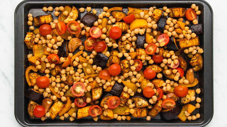 Roasted veg and chickpeas on baking sheet