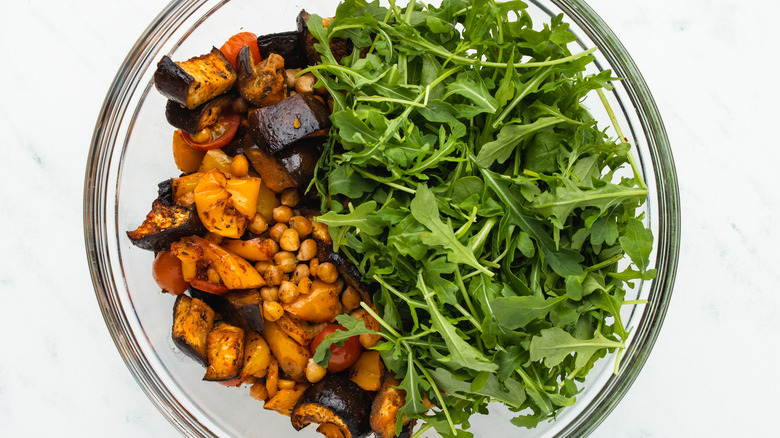 Arugula and roasted veg in bowl