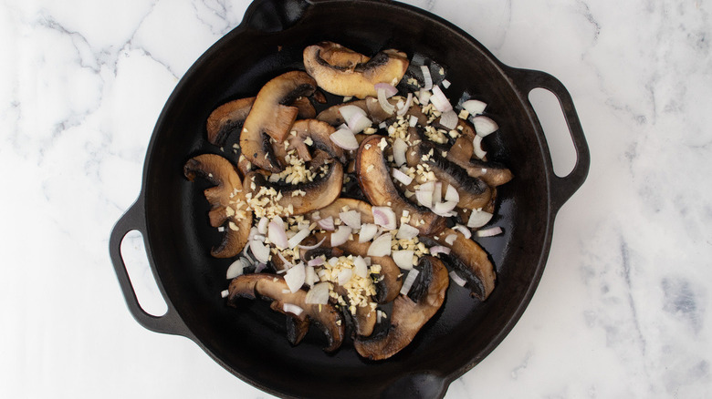 mushrooms and garlic in pan