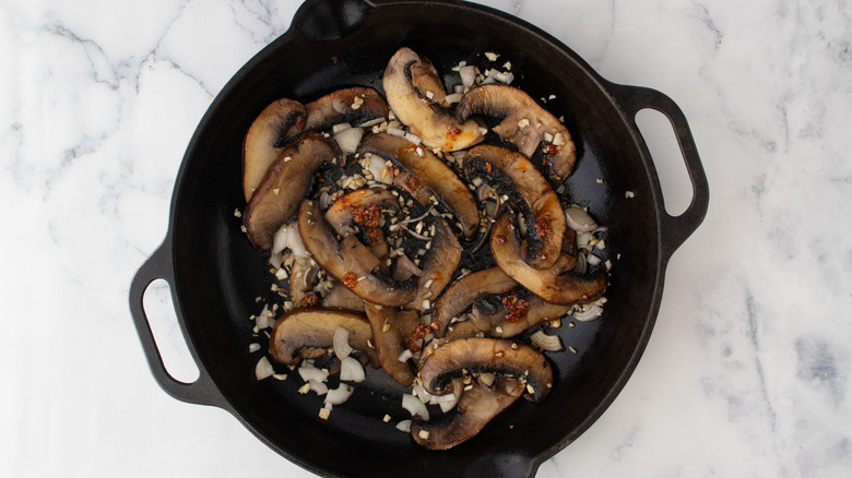 mushrooms and garlic in pan