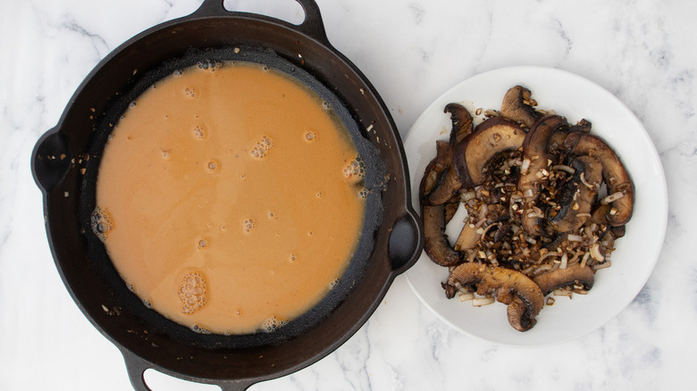 brown liquid in frying pan