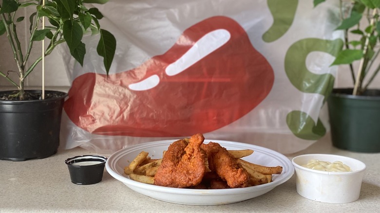 Chili's chicken crisper combo in front of take out bag