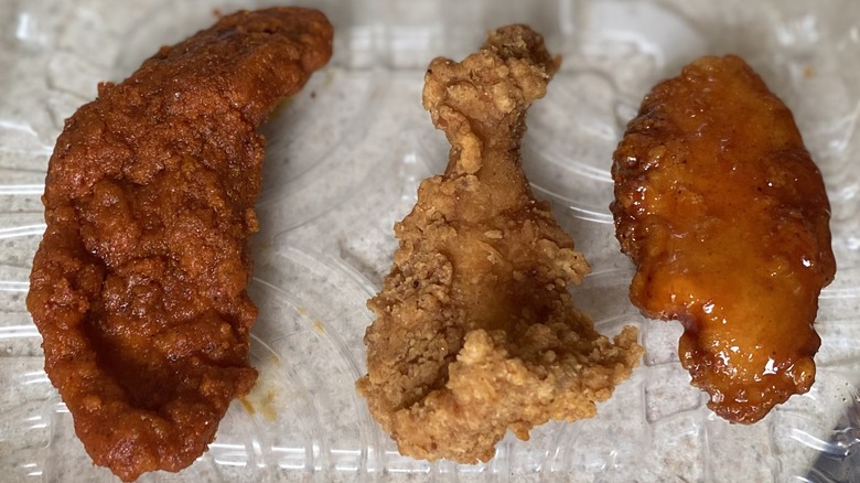 Trio of Chili's chicken crispers on plastic tray