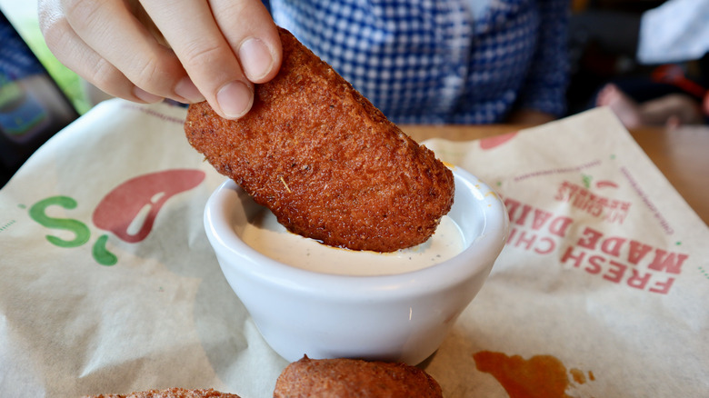 spicy mozzarella stick dipped in ranch