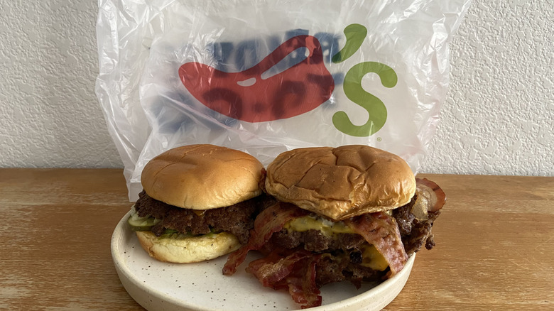 Two Chili's burgers sit on a plate