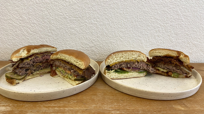 Four burger halves displayed on plates