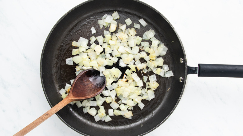 onion frying in pan