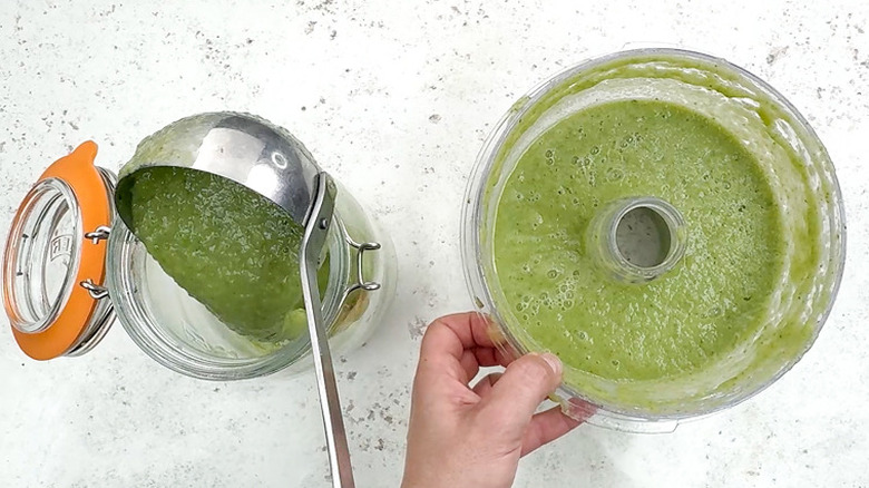 pouring cucumber melon soup in container