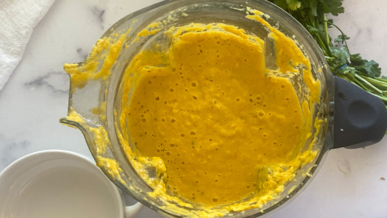 Chilled corn soup ingredients in a blender