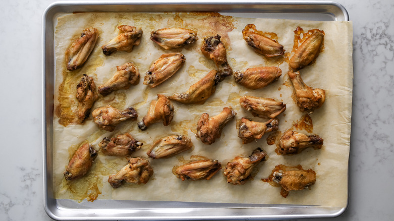 chicken wings on baking sheet