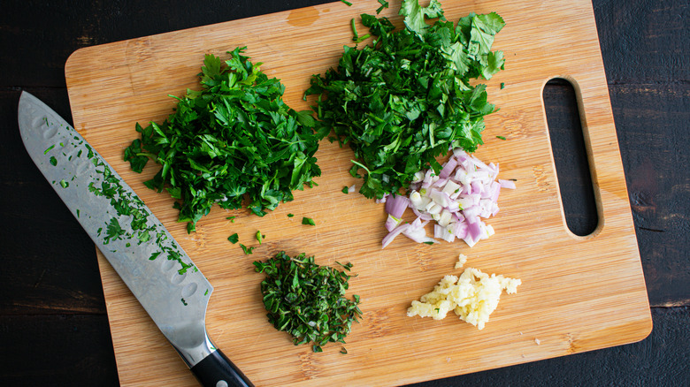 Chopped herbs on cutting board