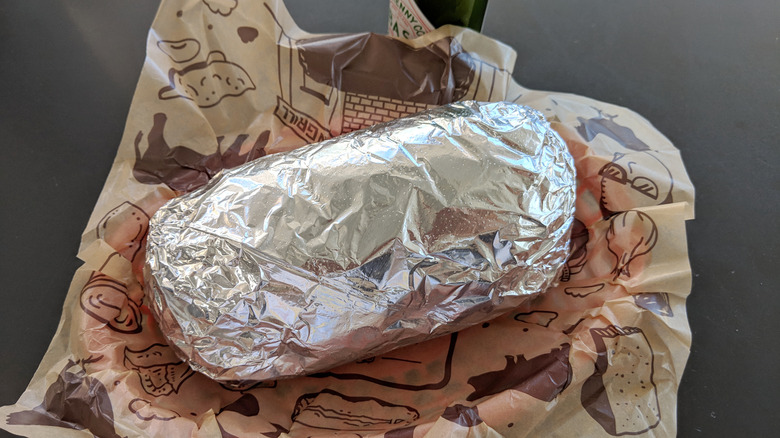 large chipotle burrito wrapped in foil 