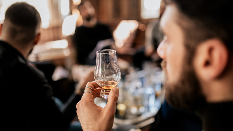 A man tasting Scotch