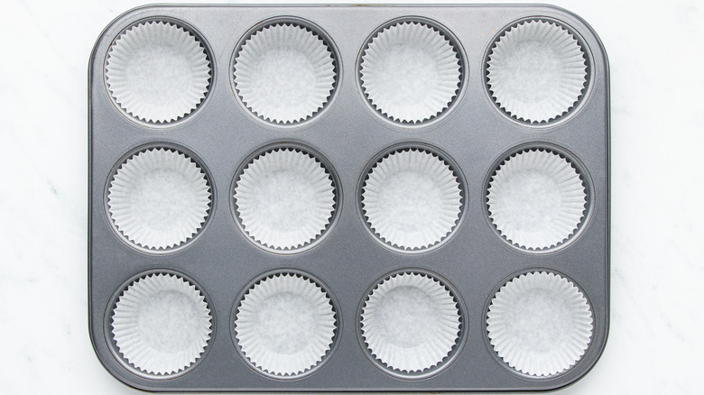 Muffin pan filled with muffin liners