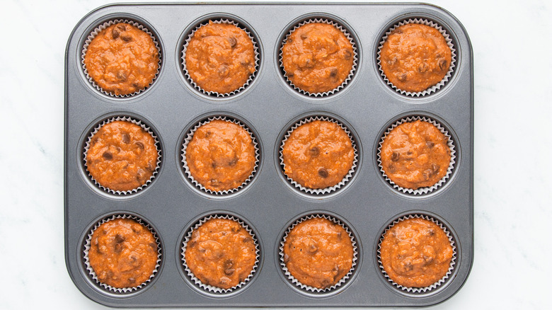 Chocolate chip carrot muffin batter in pan