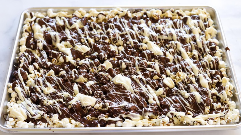 chocolate popcorn on baking sheet 