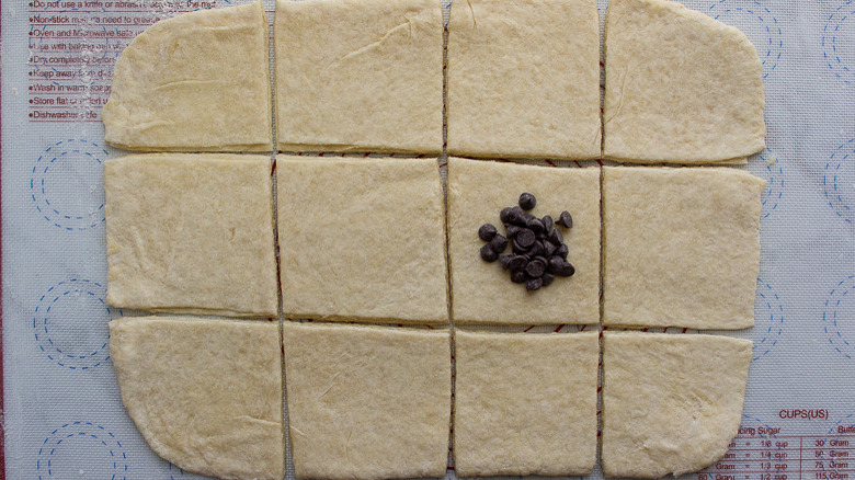 dough cut into 12 squares