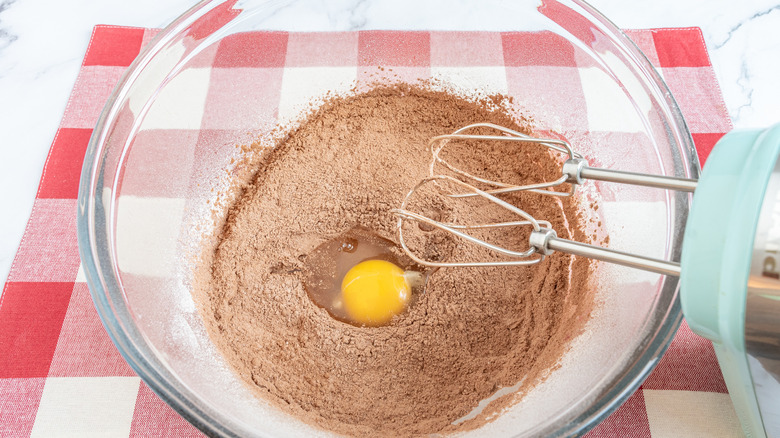 mixing egg into batter