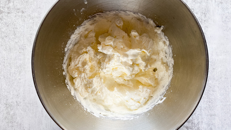 metal bowl full of whipped cream frosting