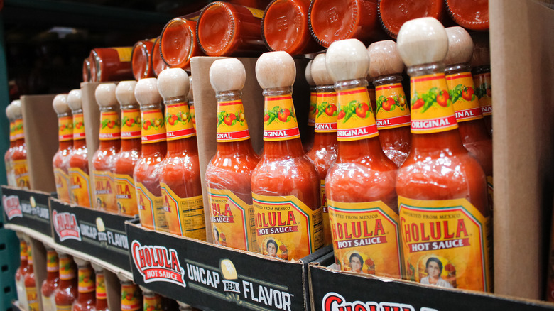 Bottles of Cholula hot sauce on shelf