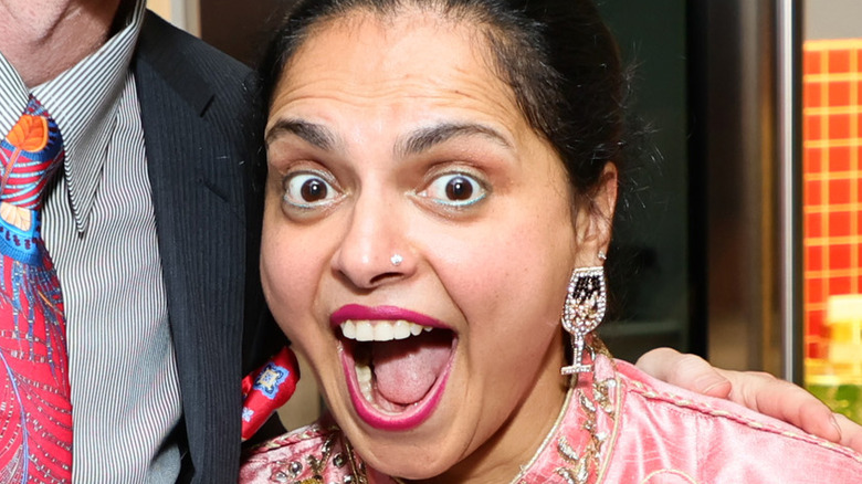 Maneet Chauhan displaying wine excitedly