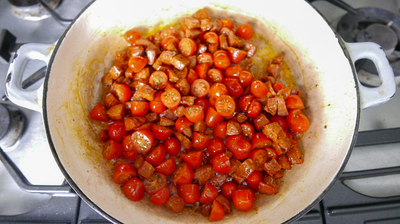 chorizo and tomatoes in a skillet