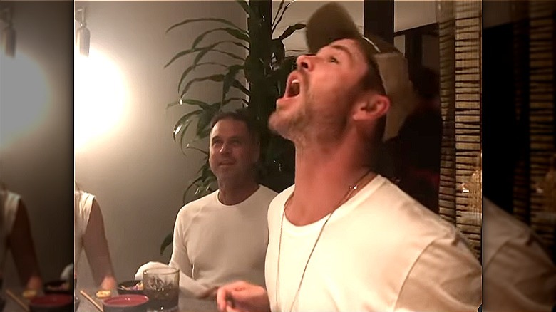 Chris Hemsworth catches food in mouth