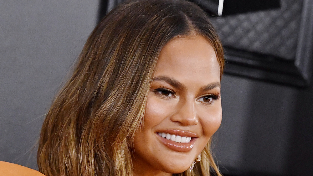 Chrissy Teigen wearing orange eyeshadow