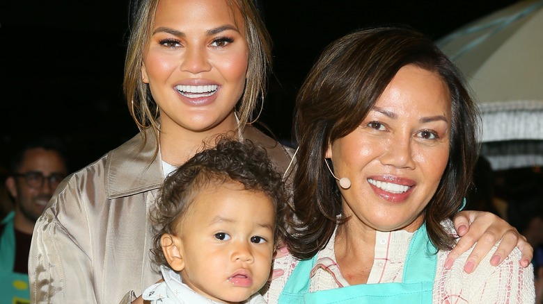 Chrissy and Pepper Teigen with grandchild