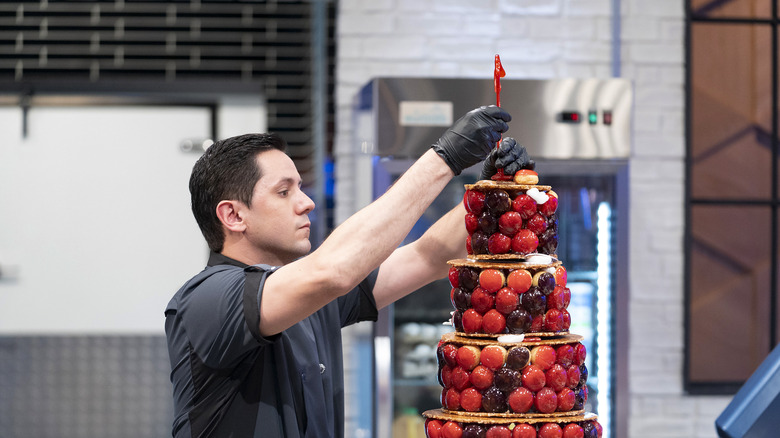 Christophe Rull topping a croquembouche